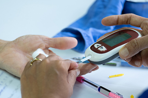 Bayonet Point Physician Taking Blood Sample of a Patient In Need of Diabetes Treatment