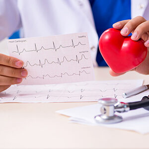 Primary Care Physician Holding ECG Results of a Patient From Bayonet Point FL